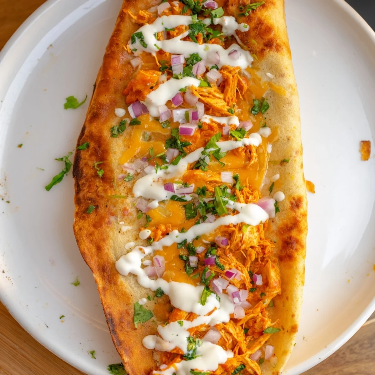 Warm, golden-brown Buffalo Chicken Quesadilla, filled with melted cheese and spicy, tender chicken.
