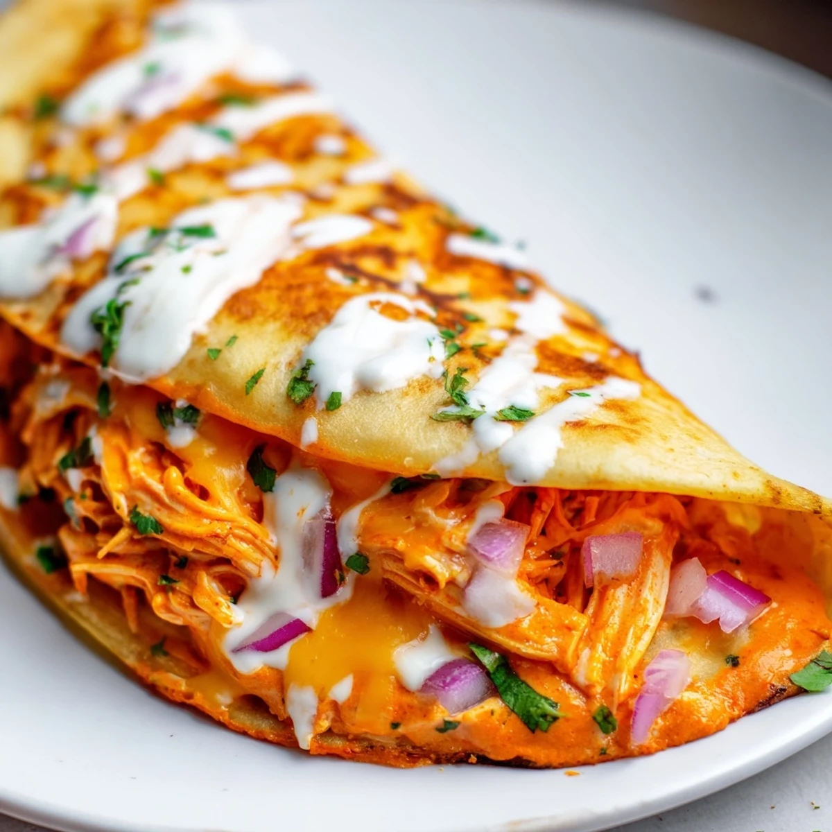 Perfectly browned Buffalo Chicken Quesadilla, featuring visible ingredients and a crispy texture, perfect for sharing.