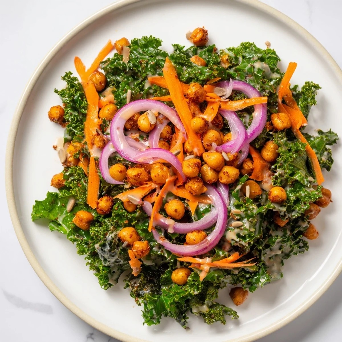 A colorful kale salad with crispy chickpeas, showcasing the roasted chickpeas' spicy aroma.