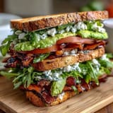 Loaded Deli Sandwich Board with assorted meats, cheeses, and fresh vegetables arranged for easy, customizable sandwich building at picnics.