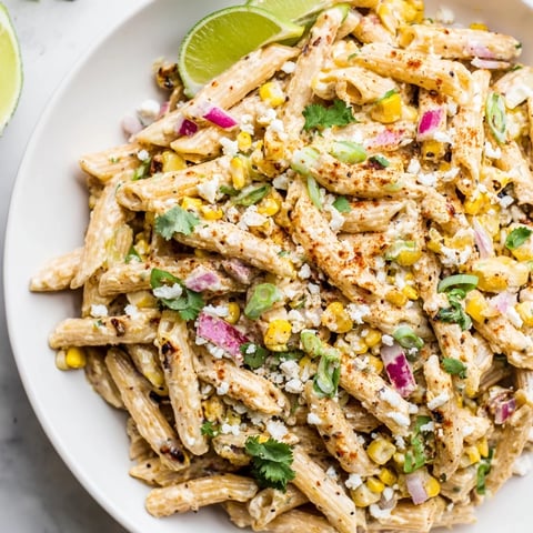 A close-up of Mexican Street Corn Pasta, showcasing the creamy sauce and vibrant colors.
