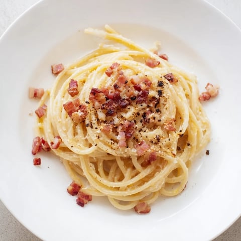 Express Spaghetti Carbonara, perfectly twirled and coated in rich, creamy sauce, ready to be devoured.