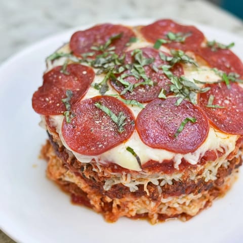 This Meat Pizza Pepperoni Stack features sizzling pepperoni atop bubbling mozzarella, a delicious low-carb meal.