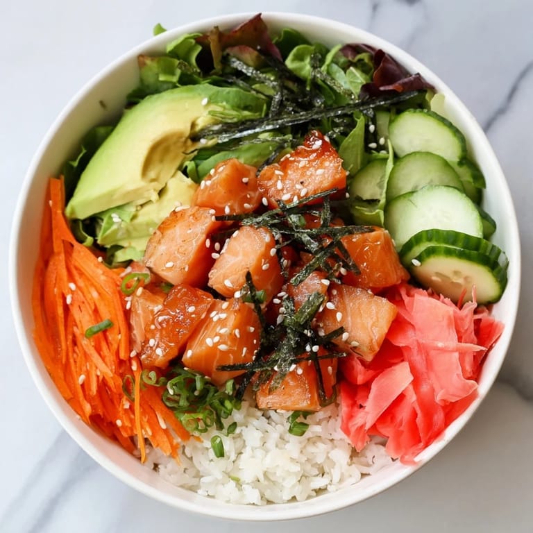 Savory soy-ginger marinated fish and fresh vegetables compose this delightful poke bowl salad.